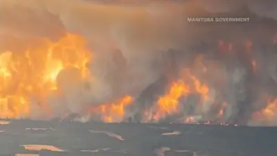 Wildfires burning across central Canada force more people to evacuate