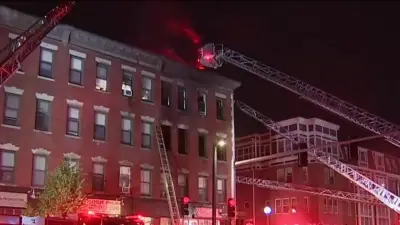 Woman rescued from heavy fire on Tremont Street in Boston, 14 displaced