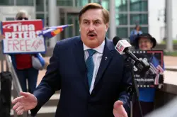 As trial opens, Mike Lindell’s attorneys say he spread claims about Dominion official because he was ‘triggered’